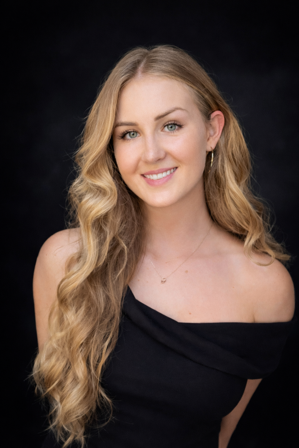 Pepita Barton, Australian photographer and filmmaker, against a dark studio backdrop
